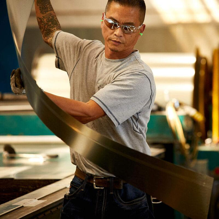 Ariat Rebar Cotton Strong short sleeve work tee in grey, shown worn on a job site