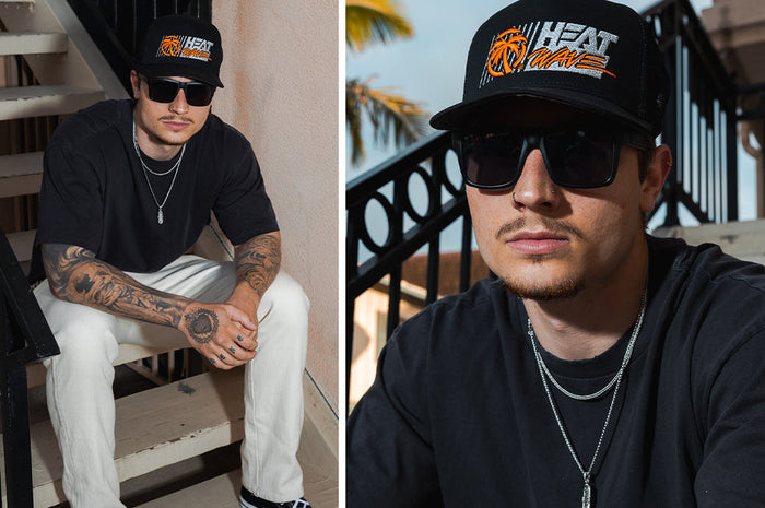 Heat Wave Vise Z87 sunglasses shown with a cap in a lifestyle setting