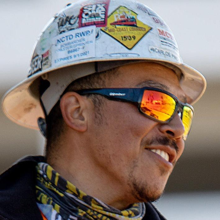 Worker wearing the Bomber Boogie Bomb red mirror safety sunglasses under a hard hat