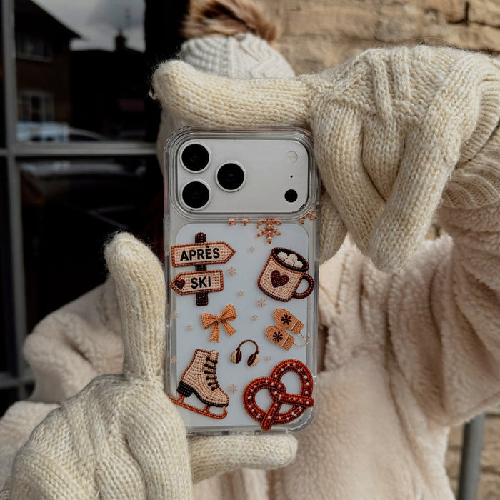 Apres Hour Clear Phone Case building help by a girl in cream gloves, coat and bobble hat