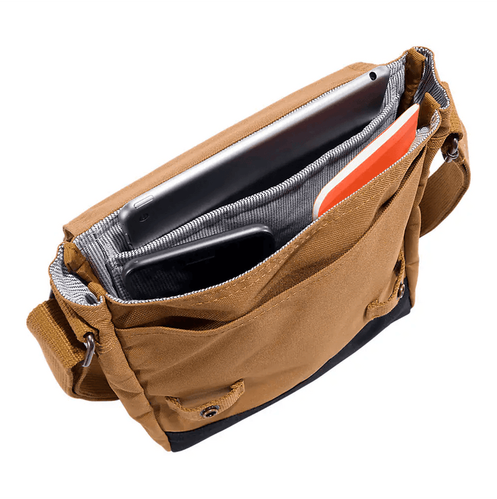 Brown Carhartt crossbody snap bag, view of the adjustable strap hardware