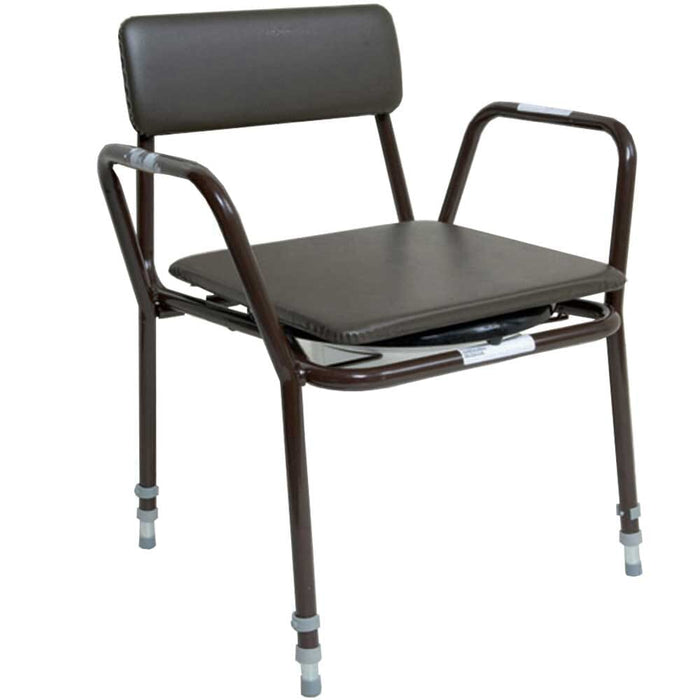 Dovedale Extra Low Commode with lid raised showing the open seat and removable commode pan, with supportive arms and adjustable height on a plain background.