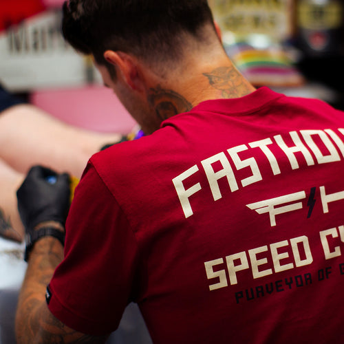 Fasthouse Elevate tee in cardinal shown on a model