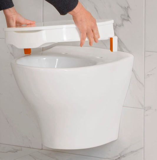 Image of Etac My-Loo Raised Toilet Seat and Lid-with Brackets on a plain background.