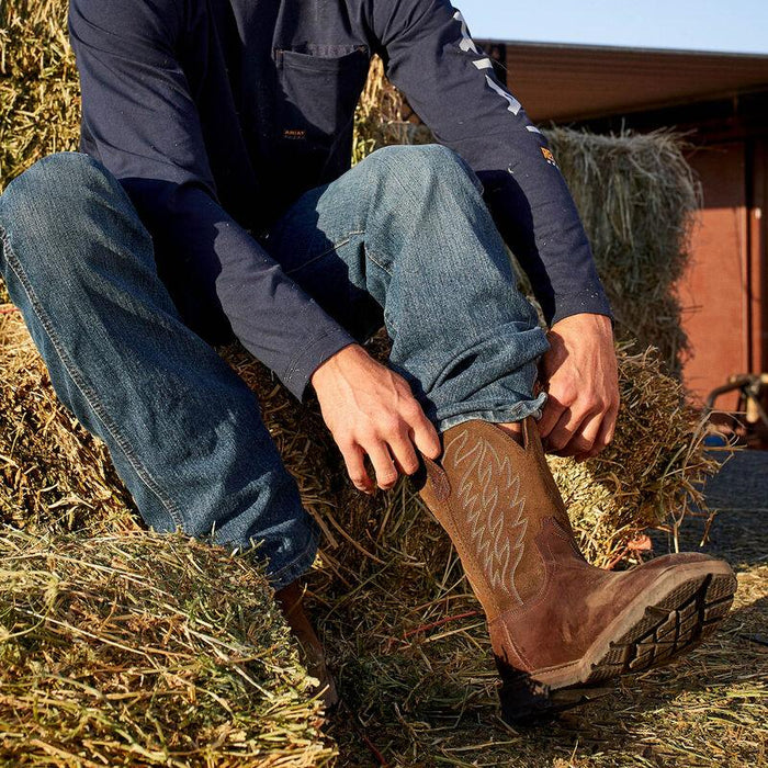 Ariat Groundbreaker work boot in brown leather, shown worn on the job in a work setting