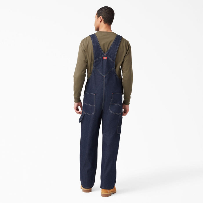 Back view of the Dickies indigo blue denim bib overall showing the crossed back straps