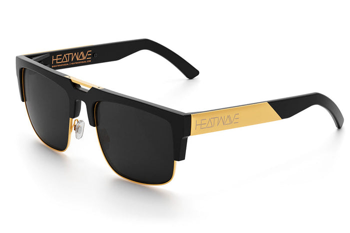 Heat Wave Interceptor sunglasses in black and gold with polarized black lens, angled view