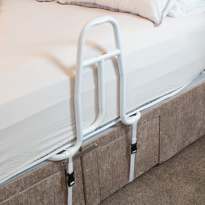 NRS EasyFit Bed Grab Rail installed next to a bath, shower or toilet, illustrating how it offers extra support and stability.