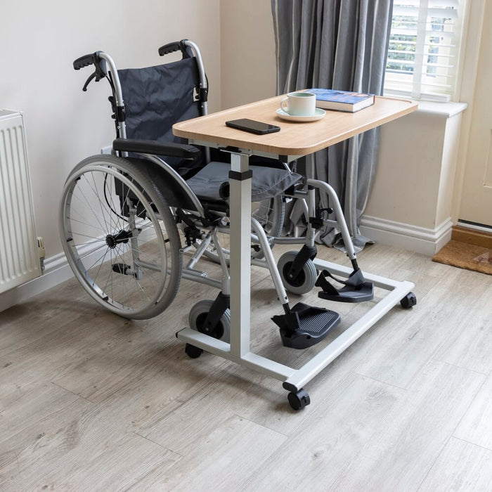Close-up of a push button or knob on NRS Easylift Home Height Adjustable Overchair Table's frame used for adjusting height or tilt.
