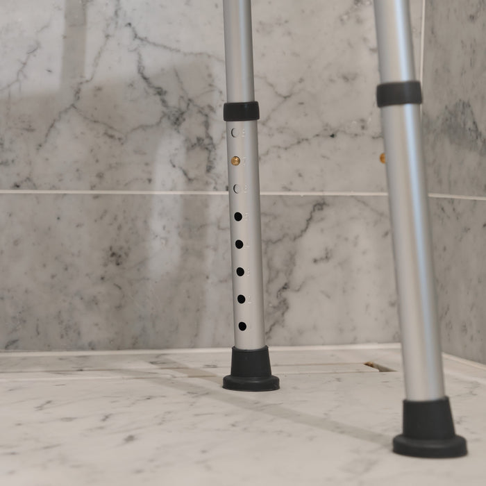 Close-up of the seat on NRS Economy Shower Chair, showing drainage holes and textured surface for comfort.