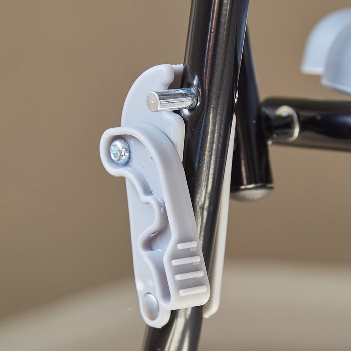 Close-up of NRS Folding Commode seat ring and supportive arms, showing comfort and stability.