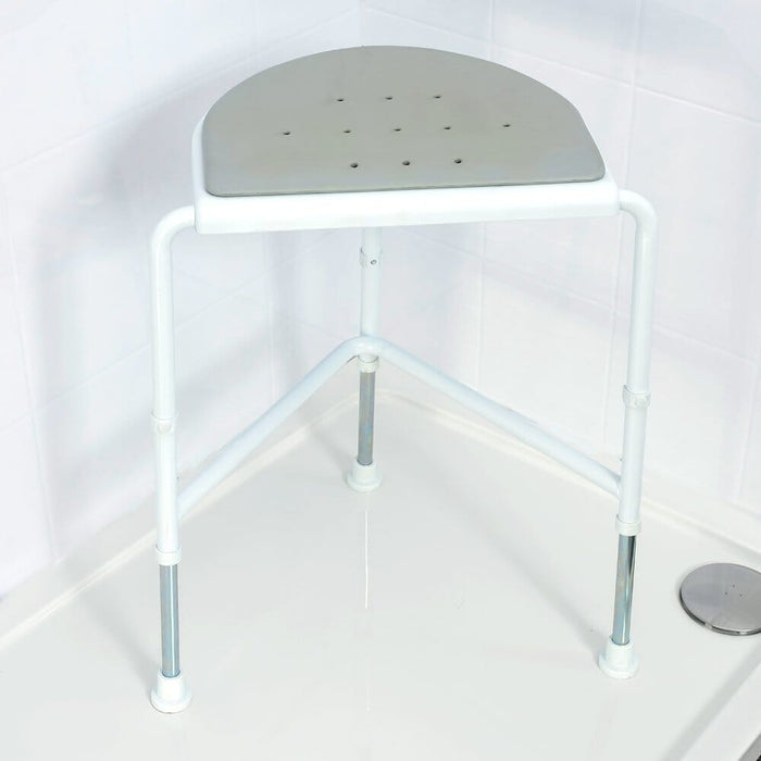 Top view of NRS NUVO Padded Corner Shower Stool showing drainage holes in the seat for quick water runoff.