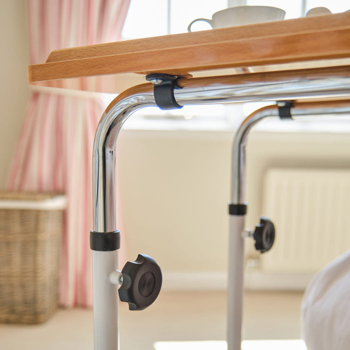 Side view of NRS Overbed Table with the table top level at its lowest height.