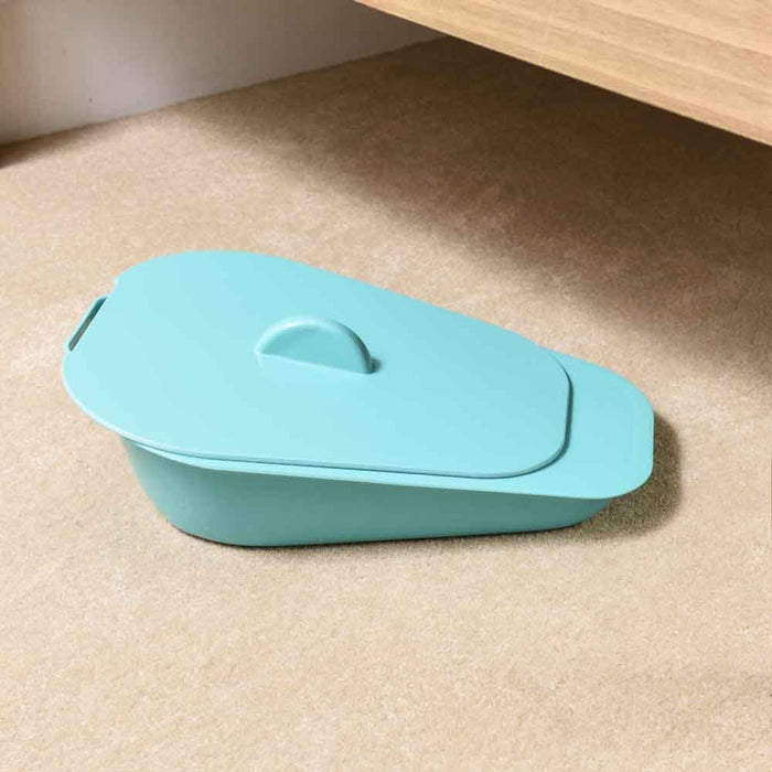 Lifestyle image of NRS Selina Slipper Bed Pan with Lid being used in a real-life setting.