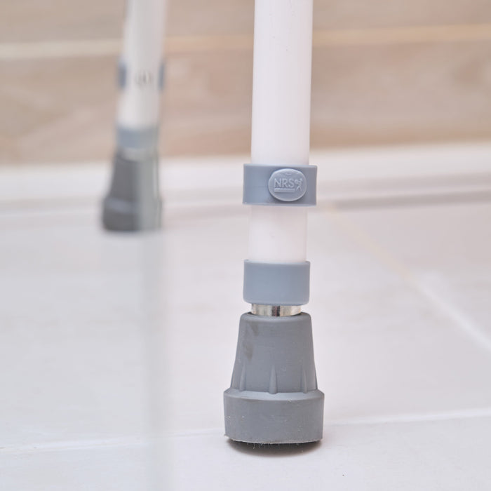 Front view of NRS Stackable Adjustable Shower Chair showing drainage holes in the seat and the supportive backrest design.