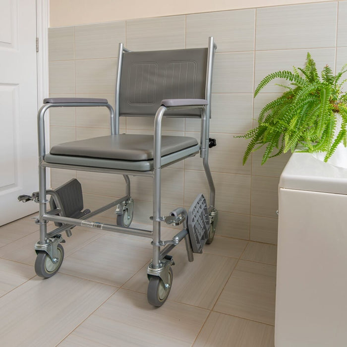 Close-up of NRS Wheeled Commode seat ring and supportive arms, showing comfort and stability.