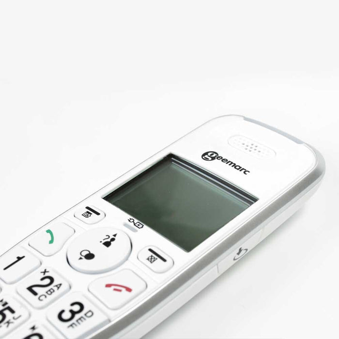 PhotoDECT Big Button Cordless Photophone being held in a hand, showing the size of the buttons and screen.