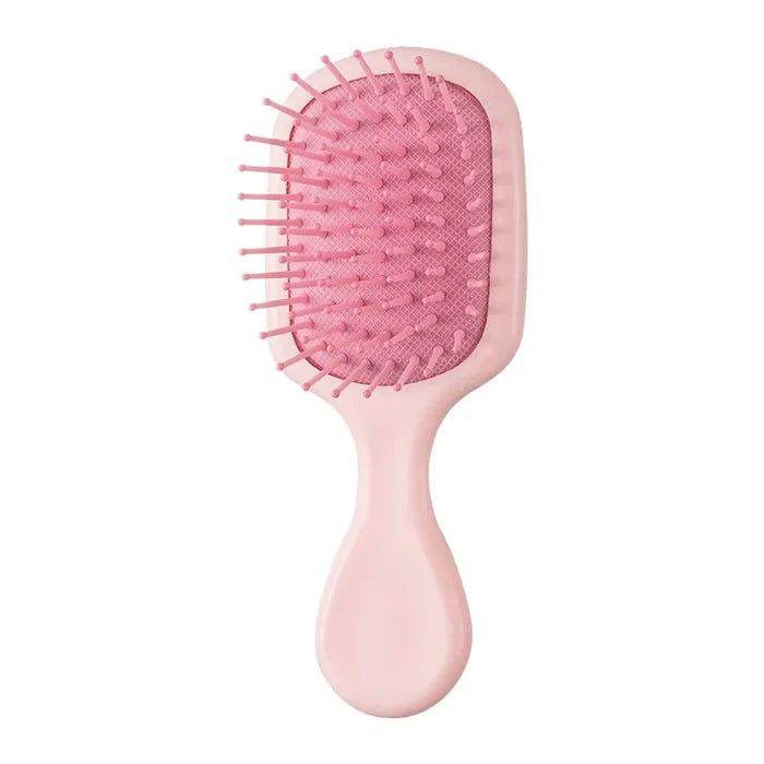 "Portable" small hairbrush pink