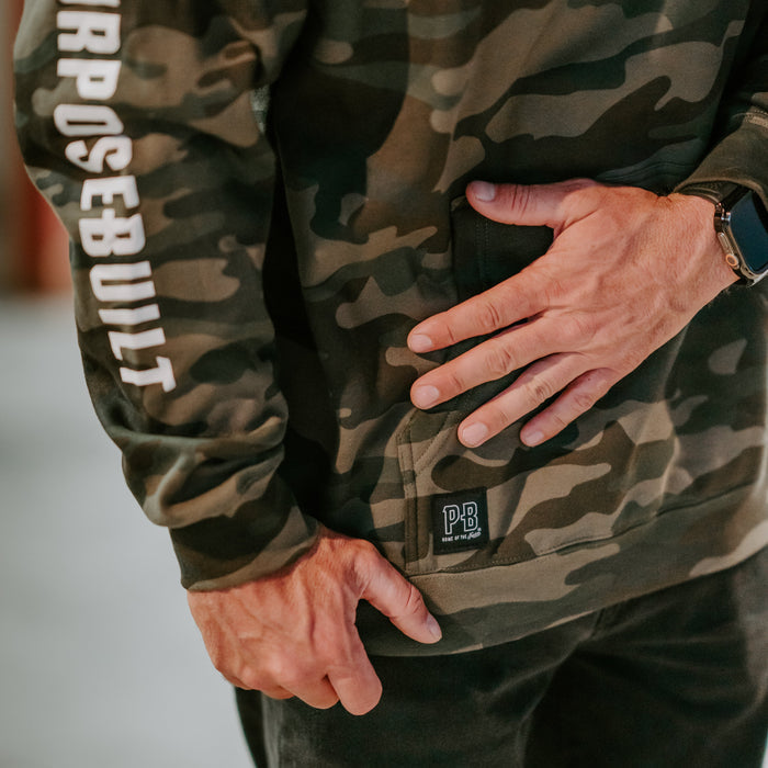 Purpose-Built camo logo hoodie, close-up of the logo print