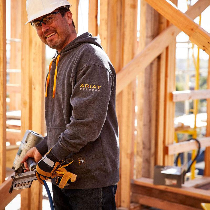 Ariat Rebar Workman hoodie in charcoal, shown worn in a job site setting, water resistant