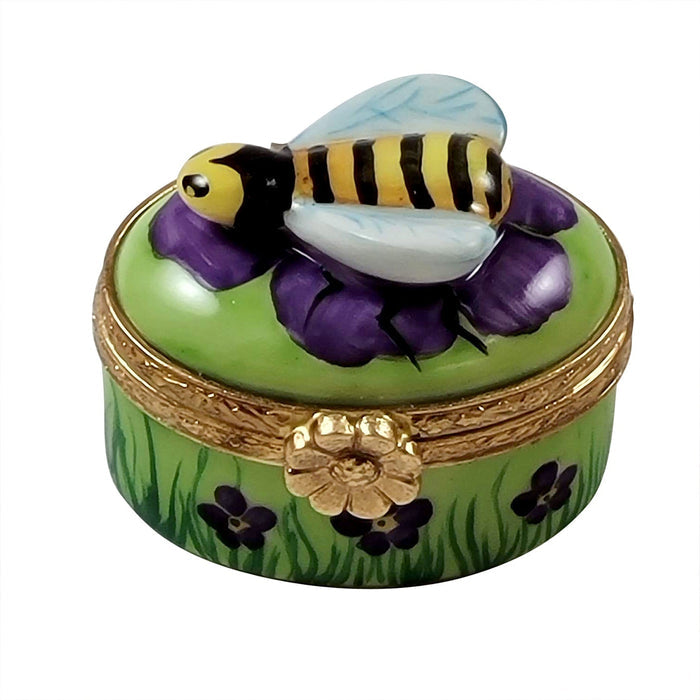 ###
A close-up image of a mini bee product made of stainless steel and wood handle