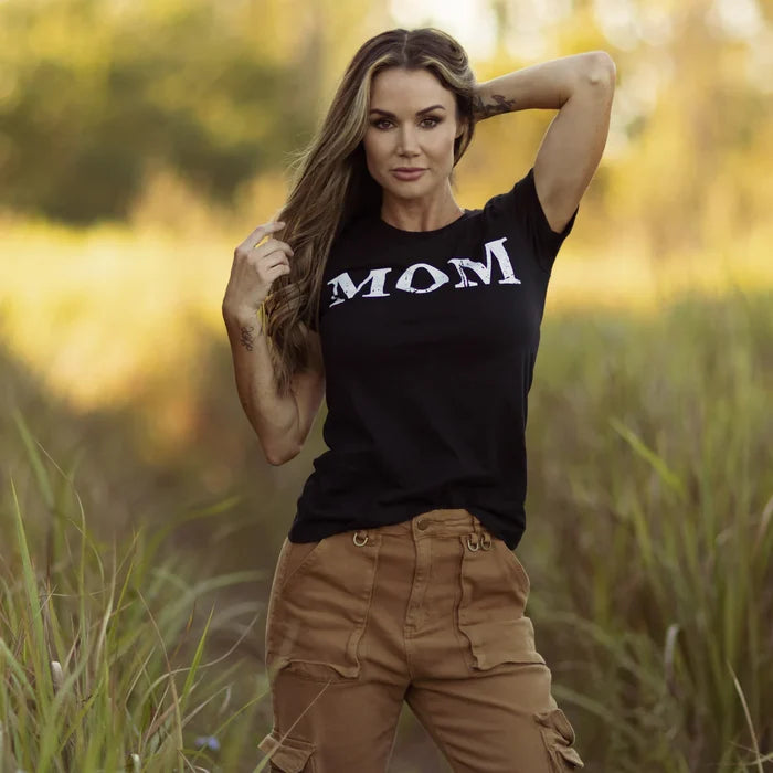 Grunt Style women's Mom Defined tee in black shown on a model