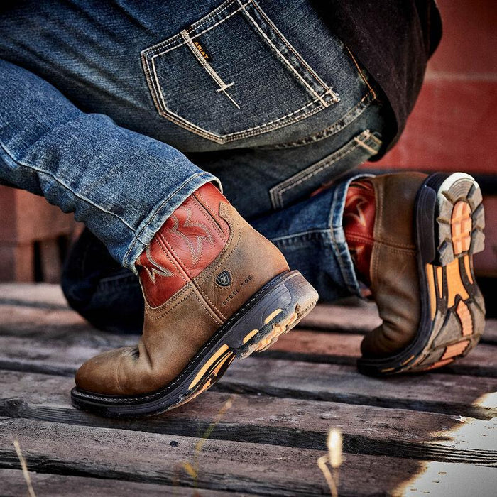 Ariat WorkHog wide square steel toe work boot in dark earth, worn on the job in a work setting