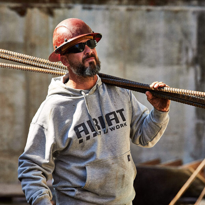 Ariat Workman Drive hoodie in heather grey shown worn on a job site